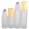 Glasklare gefrostete leere Flaschen 5 ml 10 ml Metallrollerkugel Holzmaserung Kunststoffparfümflasche Tragbare Fläschchen Reise Neuankömmling 2js G2