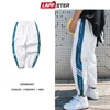 LAPPSTER Hombres Streetwear Joggers Pantalones para hombre Harajuku Hip Hop Sweartpants Male Side Striped Joggers Spring White Track Pants 201110