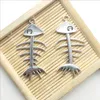 Lot 50pcs os de poisson squelette tibétain argent breloques pendentifs pour la fabrication de bijoux boucle d'oreille collier bracelet porte-clés accessoires 42 * 20mm