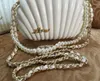 Elegant Ivory Pearl Shell wristband bag Brand Clutch Wallet Designer chain Shoulder Bag Luxury VIP gift Purse Black pearl she294w