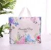 Sac cadeau en plastique à fleurs, 25 pièces/lot, grands sacs à poignée de Shopping, décoration de fête d'anniversaire, sacs d'emballage pour cadeaux H1231