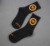 Three pairs of shadow alien orange eyes cotton sports tube Street trend socks for men and women