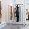 Filo di acciaio inossidabile trafilato lato argento sospeso Espositore per mobili per bambini espositore per abbigliamento da donna semplice scaffale ispessito per pavimento