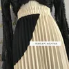 الأزياء المخملية الناعمة نتوء اللون مطوي تنورة الشتاء الإناث في غير النظامية المرقعة الأسود في التنانير Y1214