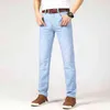 Marka męska Cienki dżinsy 2021 Lato Nowy Styl Business Casual Slim Fit Elastyczne Klasyczne Styl Spodnie Sky Niebieskie Spodnie Męskie Size28- G0104