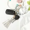 Handgjorda sträckta silikonpärlor Bangle Party Keychain Tassel Wristlet Armband Wrist PU Läder Key Ring Kvinnor Trästräng Armband Kvinnor Tjejband