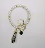 European och American Creative Fashion Beaded Pearl Bracelet PU Läder Tassel Koppar Pendant Keychain Factory Direktförsäljning