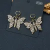 Brillant Papillon Cristal Charme Boucles D'oreilles Double Lettre Designer Goujons Coloré Diamant Bijoux En Gros