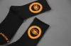 Drie paar schaduw buitenaardse oranje ogen katoen sport tube street trend sokken voor mannen en vrouwen