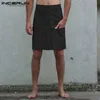 ヴィンテージの男性のスカートズボンカジュアルキルトボタンファッションパンクスタイルソリッドプリーツズボンプラスサイズ5xl