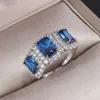 Jóias de luxo 925 prata esterlina três pedra azul safira cz diamante tanzanite feminino festa casamento noivado banda anel para lov296d