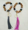 Bracelet de perles en bois à la main en bois Créatif transfrontalier bracelet en bois coréen Velvet Pendentif Tassel Porte-clés