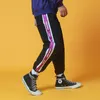 Nuevo Hip Hop Streetwear Hombres Empalme Joggers Pantalones Moda Casual Cargo Pantalón Harem Pantalón Hombres Estudiante Descuento 201110