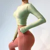 Tenues de yoga Femmes Chemise avec coussin de poitrine à manches longues Nudité Tissu lisse Gym Élastique Serré Entraînement T-shirt Sexy Crop Top8116083