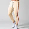 Hommes rayé Zipper pantalons de survêtement mode tendance sport Gym crayon pantalon concepteur mâle automne nouveau cordon décontracté droit maigre pantalon