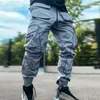 メンズヒップホップジョギング貨物パンツファッションメンズジョガーリフレクティブ光沢のあるカジュアルオーバーオール男スポーツウェア発光鉛筆パンツ