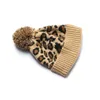 Leopard Animal Imprimé tricot fausse fourrure pompom bonnet de bonnet d'hiver femme tricot chaud fausse fourrure