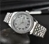 relogio masculino diamante para hombre Relojes de lujo Reloj de moda para mujer Calendario de esfera negra Pulsera de oro Broche plegable Maestro Hombre regalos parejas reloj de regalo