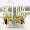 Meilleur vendeur élégant personnalisé disque en métal charme perle bracelet porte-clés fait à la main à la mode fausse perle cuir gland bracelet porte-clés