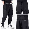 Zoenova New Black Cargo Calças Hip Hop Jogadores Homem Solto Harem Calças Multi-Pocket Ribbon Calças Casual Streetwear Calças Para Homens H1223