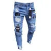 Europeiska och amerikanska mäns magra jeans med broderade hål