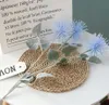 Tre fiori decorativi floccati a 6 colori ricci di mare con crisantemo simile ad artigli di granchio per matrimoni di fascia alta Home Hotel pianta