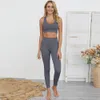 Nowe stroje jogi Moda Zestawy jogi dla kobiet Siłownia Garnitur Quick-Suszący Seamless Fitness Legginsy Spodnie Sportowe Biustonosz Ubrania Kobiet Sportswear