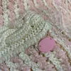 Neuestes Design Frauen Rock Pullover Häkeln Mujer Wool Strickmantel Kleid zweiteiliger Anzugsgürtel Korsett Logo Knopf 5A Qualitäten weibliche Appa2794737