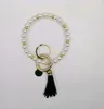 European and American creative fashion beaded pearl bracelet PU leather tassel copper pendant keychain factory direct sales