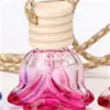 Glas bil parfymflaska dekorera hängande rosa blomma formad utsökt luft fräschare eterisk oljediffusor flaskor varm försäljning 1 4js k2