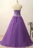 Charmig lila quinceanera klänningar bollklänning tulle pärlstav applikationer söta 16 klänningar plus storlek lång formell kväll prom party gowns qc1560