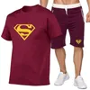 Män designer tshirt svarta spårsräder vår och sommar 2 stycken set mens tryckt rund hals casual t shirt fitness träning jogging kort ärm + sportbyxor kostym