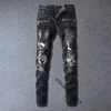 メンズデザイナージーンズが不良バイカースリムフィットオートバイバイカーデニムマンSファッションマンブラックパンツを注ぐ