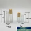 Botellas de vidrio transparente escarchado Botellas de rodillos recipientes con bola de rodillo de metal y tapa de plástico de grano de madera para perfume de aceite esencial 5ml 10ml