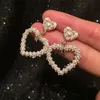 Bellissimi orecchini di perle intrecciate nuovi orecchini a bottone con pendente a cuore alla moda per studentesse e studentesse S925 argento post