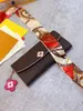Le sac à cartes portefeuille populaire pour femmes est élégant et pratique avec une bordure en cuir rose et une décoration florale délicate2288
