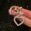 Bellissimi orecchini di perle intrecciate nuovi orecchini a bottone con pendente a cuore alla moda per studentesse e studentesse S925 argento post