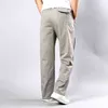 Pantaloni casual da uomo Autunno Plus Size Straight Plus Size 5Xl Tasca laterale Tattica Tuta larga in cotone nero Pantaloni cargo da uomo G0104