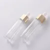 En gros, une bouteille en verre de forme hexagonale unique Perfume Perfume Bouteille de gouttes de sérum 30 ml avec couvercles de compte-gouttes en plastique blanc
