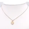 Rostfritt stål mode hjärtformat t halsband korta kvinnliga smycken 18k guld titan persika hjärthalsband hänge