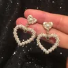 Bellissimi orecchini di perle intrecciate nuovi orecchini a bottone con pendente a cuore alla moda per studentesse e studentesse S925 argento post