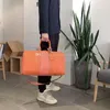 Designers handväskor stor kapacitet totes axelväskor bokstäver blomma påsar mode unisex rese väska blixtlås äkta läder män duff9201815