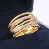 Fantazyjne sznurki Kobiety Złoty kolor z mikro kryształowym cyrkonem Delikatne obrączki ślubne Lady Fashion Jewelry6004014