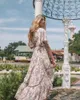 Vintage chic mujer estampado floral manga corta rayón vestidos bohemios señoras cuello en V borla verano Boho plisado Maxi vestido vestidos Y282d