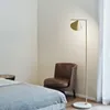 Moderna lampada da terra nordica oro nero soggiorno Ins camera da letto postmoderna E27 illuminazione da terra in marmo per soggiorno camera da letto