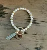 European and American Creative Fashion Pearl Bracelet Keychain Serpentine Tassel Copper Pendant Keyring