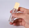 2022 Novos recipientes de frascos de frascos de rolos de vidro claros com bola de rolos de metal e tampa de plástico de grão de madeira para perfume de óleo essencial 5ml 10ml