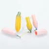新しい黄色のピンクのかわいい形バナナの口紅リップバームチューブの空の高品質プラスチック唇のチューブリッツスティック光沢容器20pcs