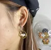 2021 nuovi orecchini geometrici dorati europei e americani di moda lettera orecchini rotondi cavi orecchini asimmetrici di personalità