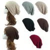 Мужской Трикотажные Hat Зима Мужчины Женщины Beanie Теплые черепа Caps Дизайн этикетки Вязаные шапки Грязный Bun Knit Хип-хоп Gorros Открытый Ухо Muff 2020